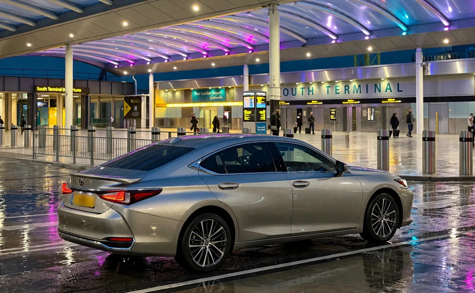 Beyond Elite Travel executive Lexus saloon at the Gatwick South Terminal forecourt on a wet evening