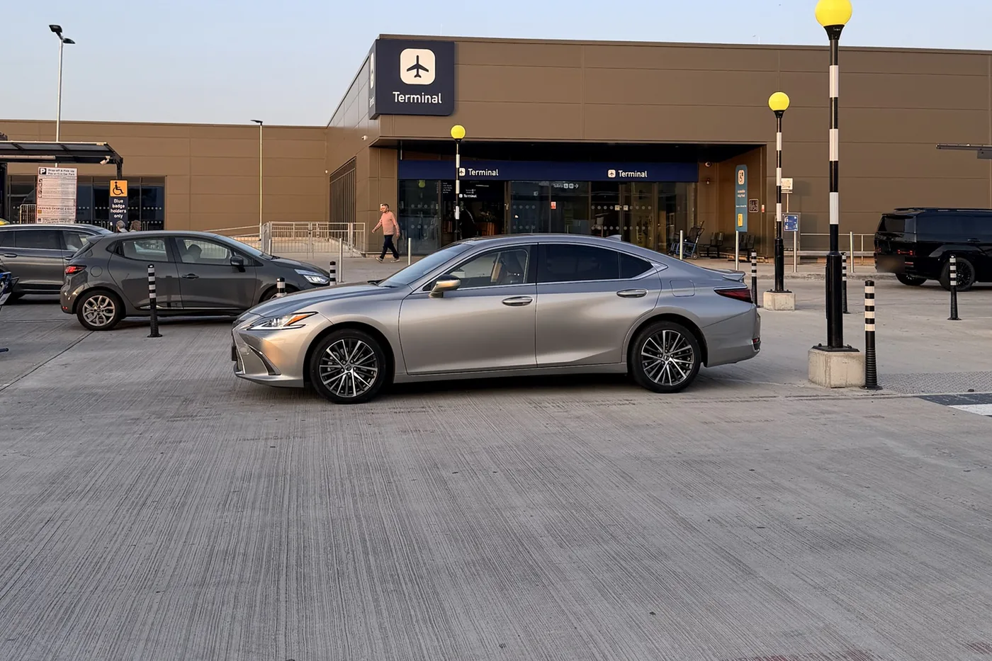 Beyond Elite Travel executive Lexus saloon outside the Bristol Airport terminal